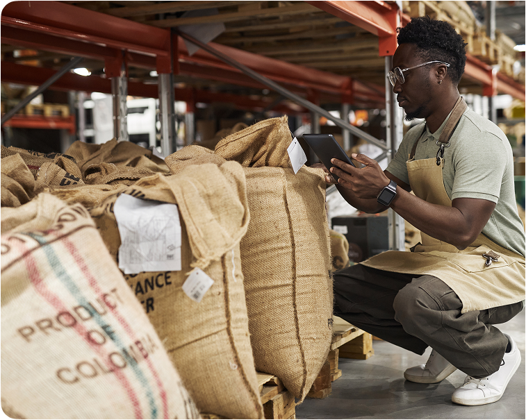 Warehouse worker checking commodity bags